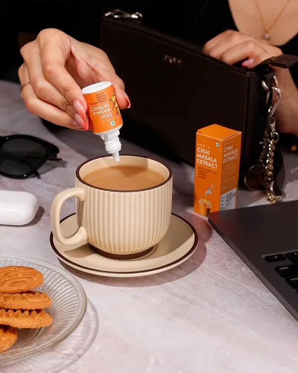This lifestyle photo shows Sprig's Chai Masala Extract in a natural, everyday work setting. My goal here is to place the product directly into the customer's life, making it feel both aspirational and essential for their daily routine.