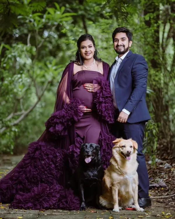 This is one of my favorite family maternity shoots. We went to a beautiful green park to get this shot, and I love how we included their two gorgeous dogs. It’s a perfect portrait that captures the whole family waiting for their new arrival.