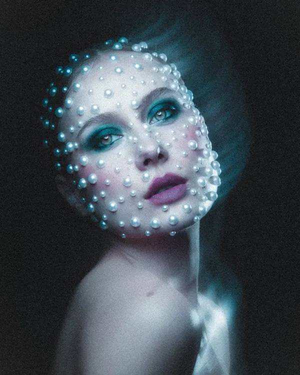 This celestial-inspired look is one of my favorites. We spent hours carefully placing each pearl to create this ethereal, otherworldly effect for a high-concept beauty portrait.