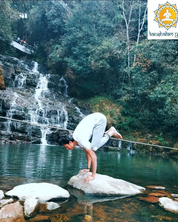 Here, I practice Bakasana, the Crane Pose, on a rock amidst a flowing waterfall. This arm-balancing asana requires immense focus and core strength, teaching us to find stillness and stability even when surrounded by constant movement.