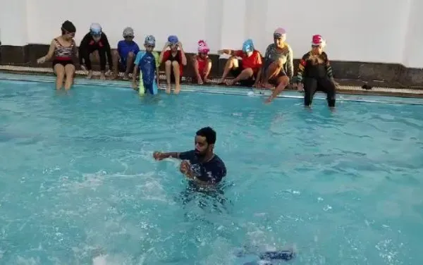 The last day of summer camp often ends with a big splash and lots of fun with the coach.