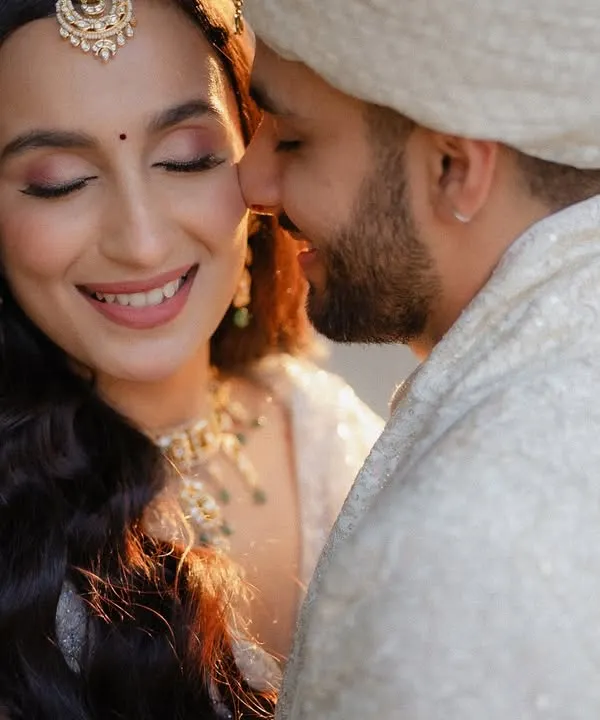A close-up of a tender moment between the bride and groom, filled with genuine emotion and happiness. These are the candid shots that truly tell a love story.