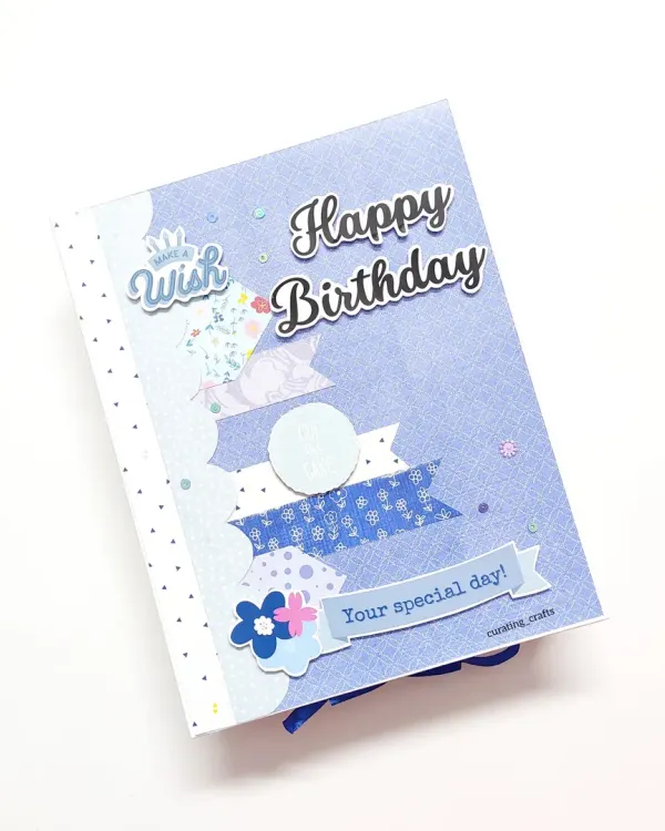 A pretty A5 size "Happy Birthday" scrapbook in a lovely blue theme, designed as a special gift for a client's husband.