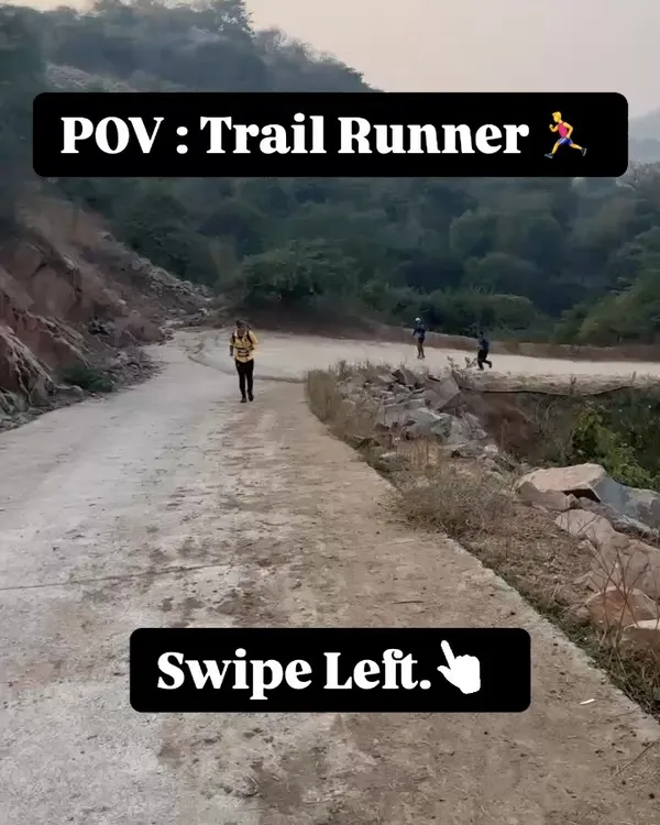 A point-of-view shot of a trail runner on a winding dirt path. This image sets the scene for the unique challenges and beauty of trail running.