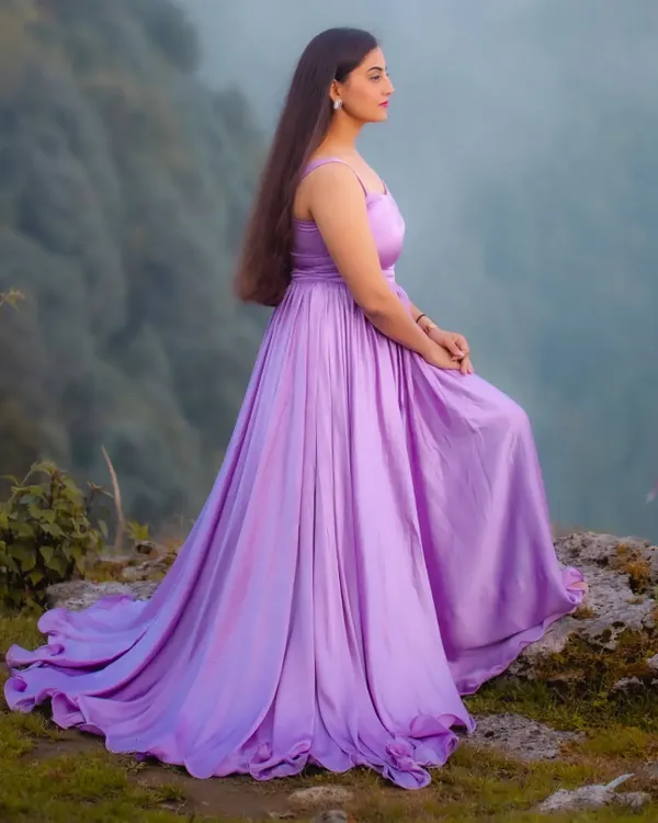 A side profile of the custom lavender gathered dress, showing how the fabric drapes beautifully. I designed this piece to be both elegant and comfortable, allowing for natural movement during a photoshoot. It's available for custom order in any color.