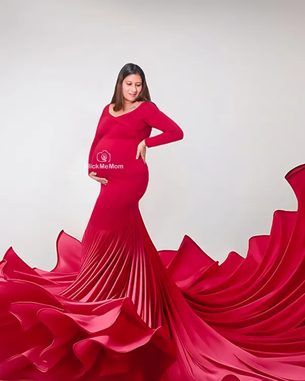 The power of red. This stunning gown with its dramatic, pleated train creates a breathtaking silhouette. I use fabric tossing techniques to add movement and life to the portrait, making you look and feel powerful.
