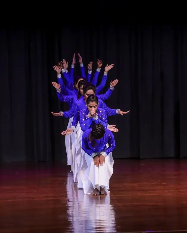 We create powerful visual moments on stage through synchronized group choreography. This formation from our production 'KALKI' showcases our troupe's precision and the dramatic storytelling we build into every performance.