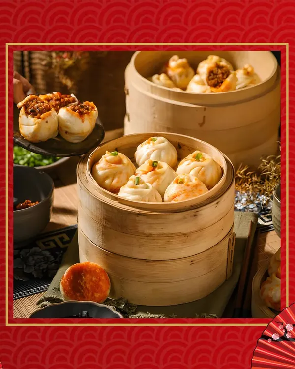An assortment of freshly steamed dim sum presented in traditional bamboo steamers. We offer an exquisite selection of Pan-Asian delights for your events.