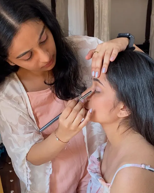 Here I am, focused on the details of an eye makeup application. Precision is key, especially for close-up beauty shots.