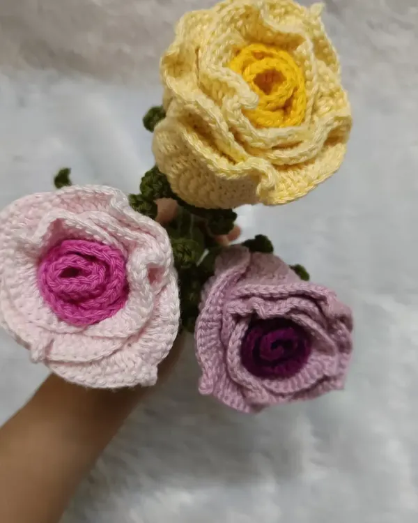 If you want something different from the usual red roses, I love making these dual-color versions. This bouquet features a pink, yellow, and lavender rose, each with a darker shade in the center.