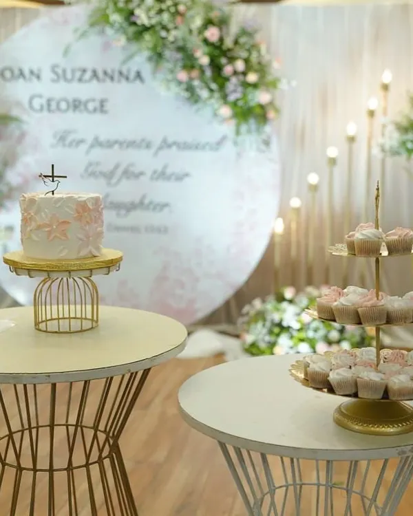 A beautiful baptism cake and matching cupcakes on a treat table. I love this trend of setting up a dessert table for events. It's such a hit with both kids and adults!