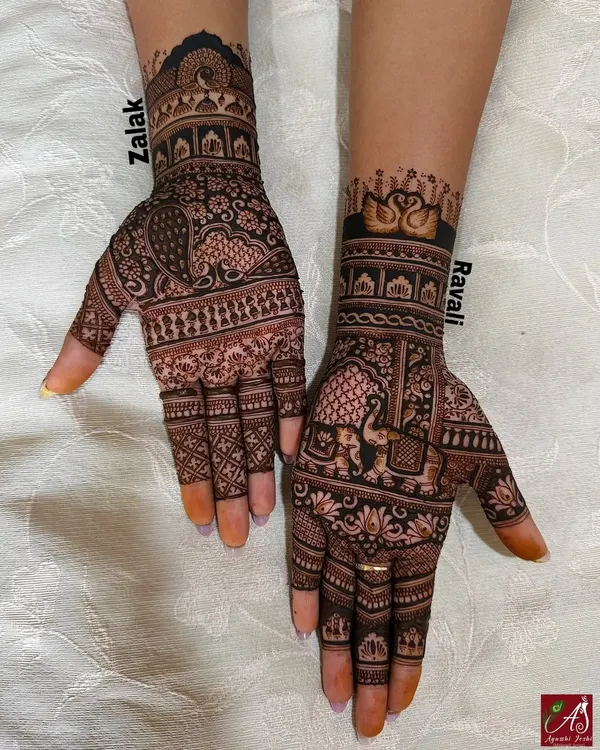 A heavy Indian mehendi design featuring a mix of traditional motifs, including elephants, swans, peacocks, and intricate grid work.