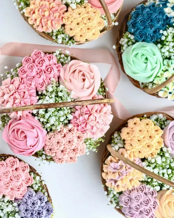 This is my signature Floral Cupcake Basket, a true work of art. I pipe each vanilla buttercream flower by hand onto a moist Belgian chocolate cupcake, creating a stunning edible bouquet that’s almost too pretty to eat.