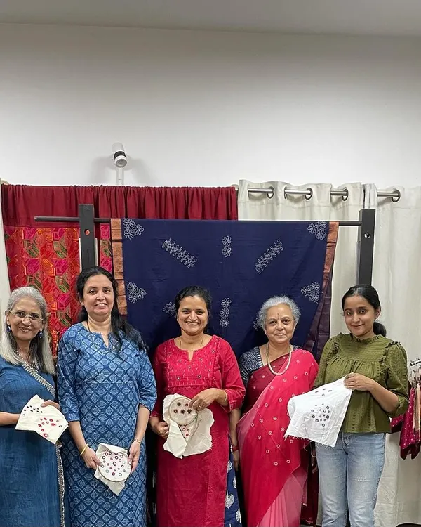 A group of happy students proudly displaying their finished mirror work samplers. It was a wonderful experience teaching these enthusiasts who were so intrigued by the techniques.