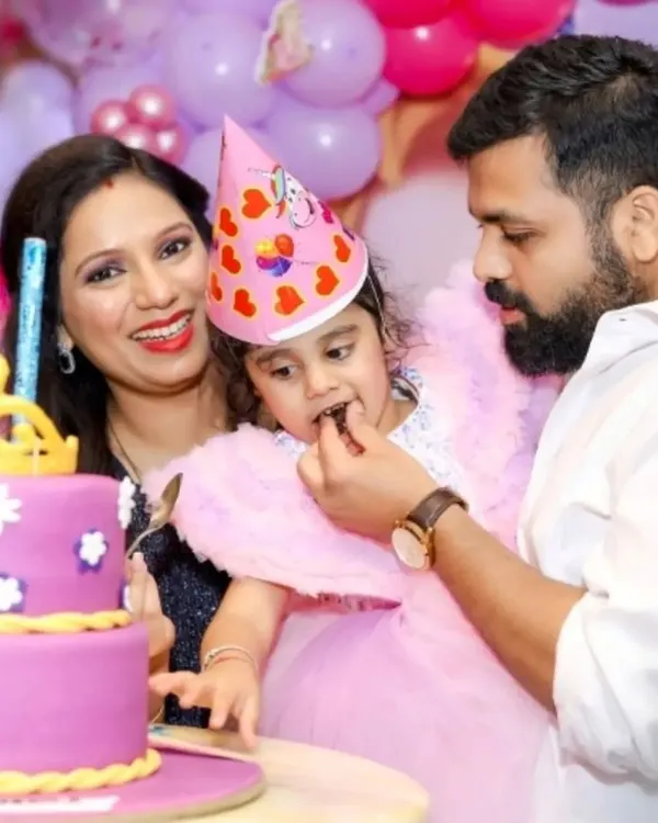 A sweet moment of the birthday girl getting her first taste of cake. I focus on capturing these key party traditions.