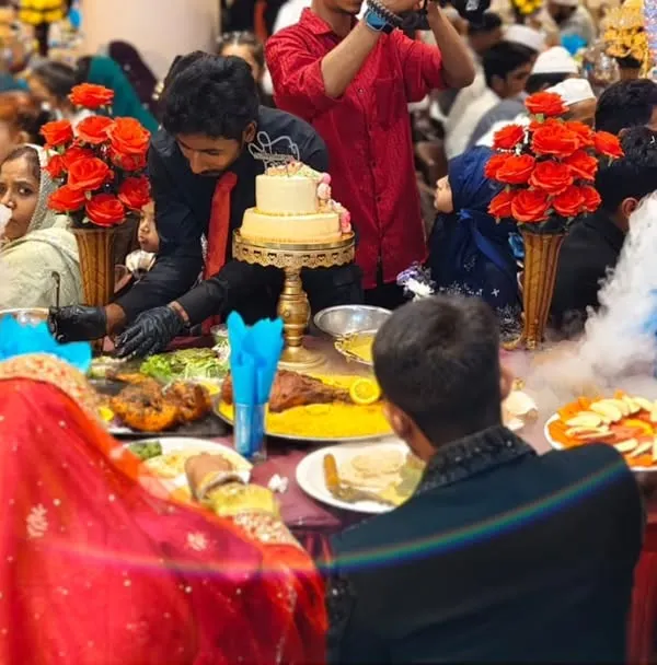 This is the experience we promise. A grand 'Nousho ka Table' set for the bride and groom, surrounded by family, with our signature dry ice smoke creating a moment of pure magic. We handle every detail, from the elaborate food platters to the seating, so you can cherish the celebration.