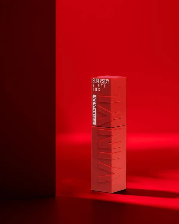 A bold and dramatic shot for Maybelline's Super Stay Vinyl Ink. The monochromatic red setup creates a powerful, brand-aligned visual that is both artistic and commercial.