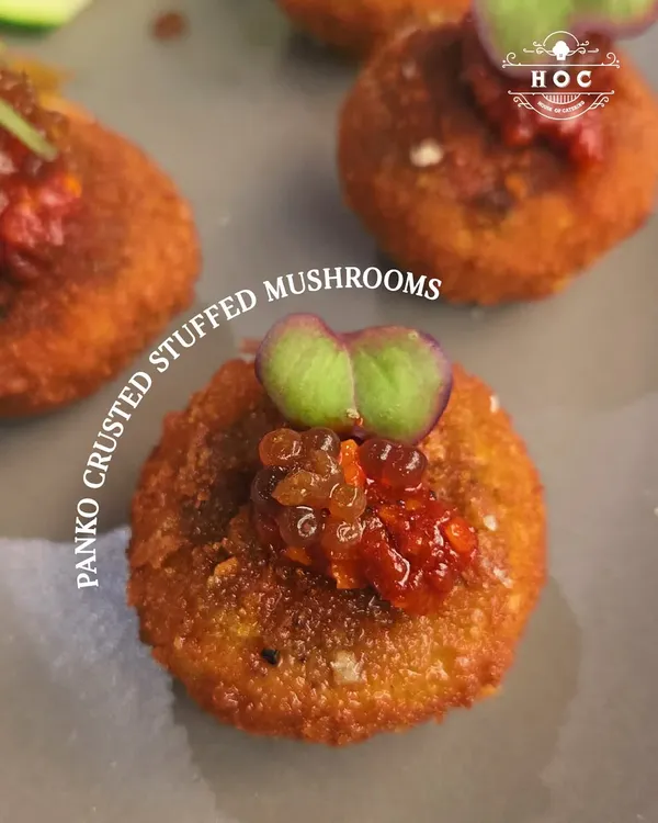 This panko-crusted stuffed mushroom offers a delightful contrast in textures. The crispy golden exterior gives way to a savoury, earthy mushroom filling, all balanced by a touch of sweet and spicy relish on top.