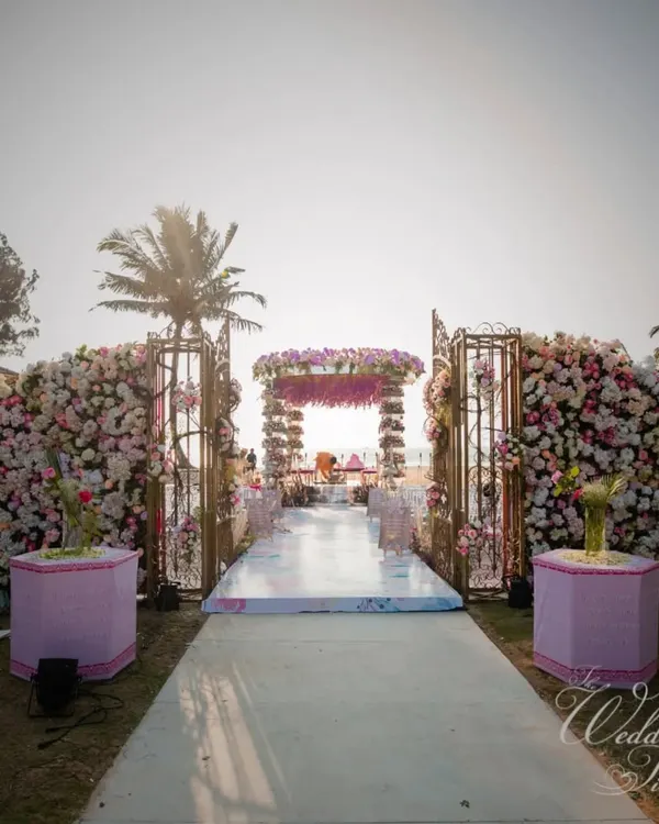 A truly grand entrance for a beachside wedding in Goa. We designed this floral-laden aisle leading to a magnificent mandap, creating a spectacular pathway for the couple's new beginning.