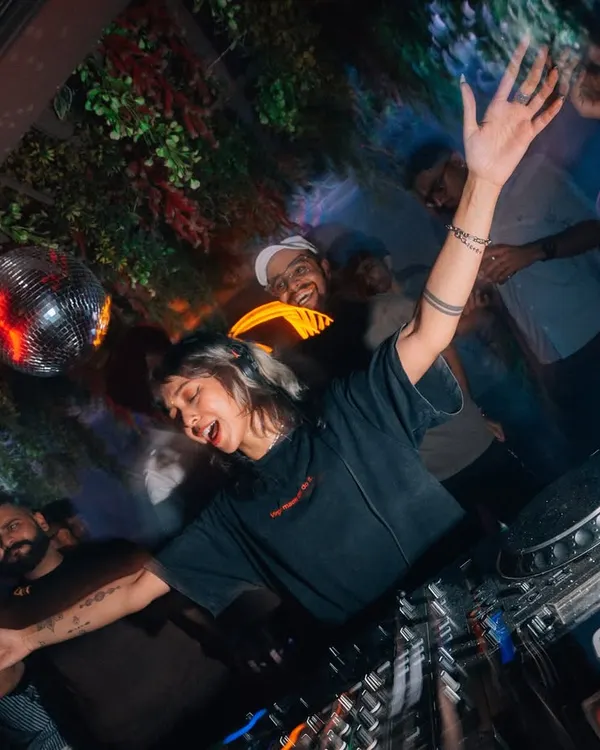 This is me in my element. When I'm on the decks, it's all about creating a high-energy, no-judgement space where you can let loose and just dance.