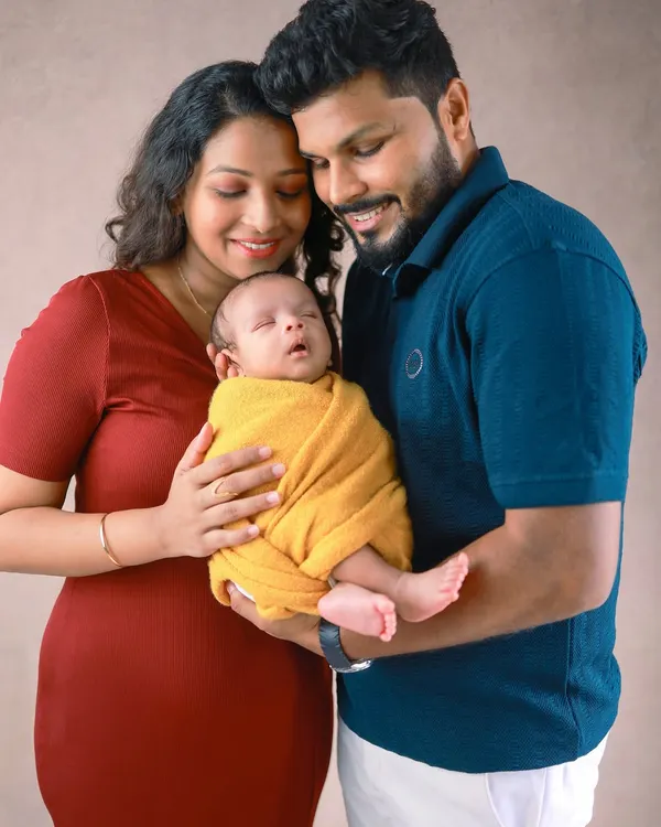 Wrapped in love, held forever in their parents' arms. This is the essence of a newborn family session, capturing the complete adoration and wonder of welcoming a new life.