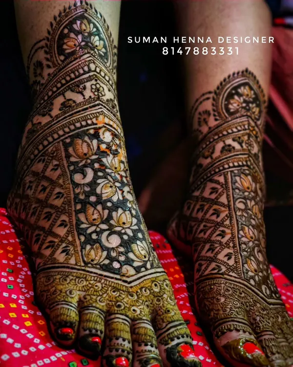 Intricate bridal feet mehndi featuring a beautiful pattern of lotus flowers. The design provides full coverage over the feet, creating a stunning look from every angle.