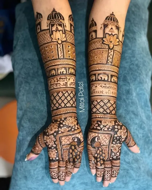 A stunningly detailed bridal mehndi featuring palace architecture, lotus flowers, elephants, and auspicious scriptures for a truly traditional look.