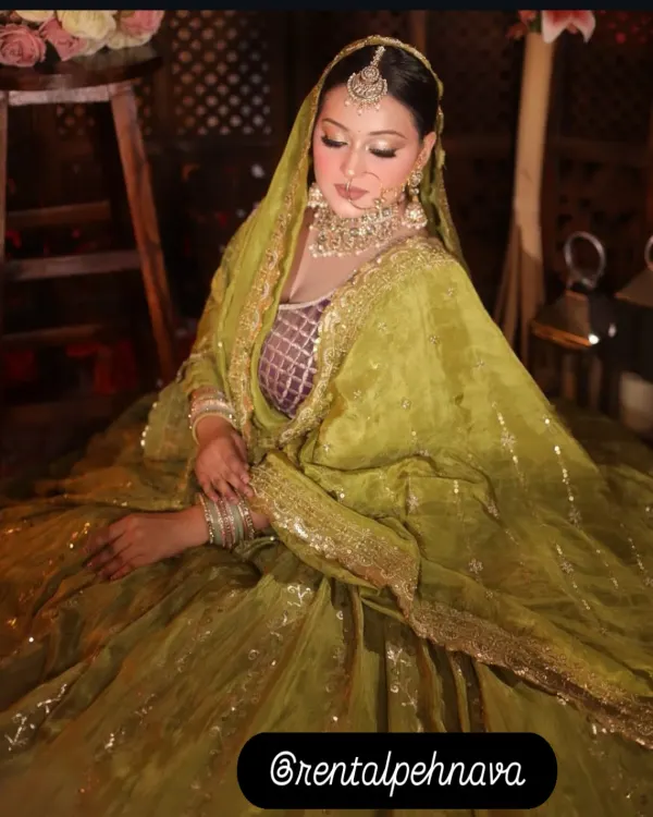 This olive green lehenga with a sequined dupatta is a perfect choice for a Mehndi function. The color is unique and photographs beautifully.