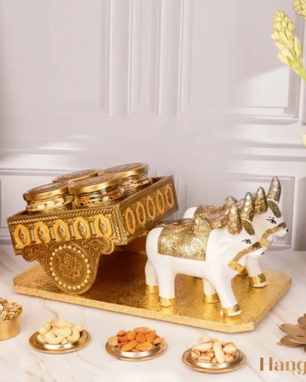 My Sanskriti Diwali Gift Hamper is designed for a touch of tradition. The decorative bullock cart holds jars of festive treats, making it a unique centerpiece and a memorable gift that celebrates our cultural heritage.