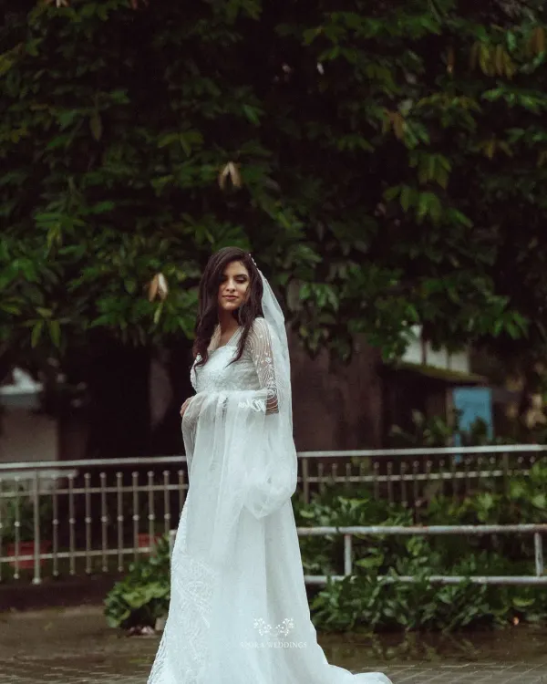 A portrait of bridal grace, with a flowing veil and a gown that tells a story of romance. I work with you to ensure every element of your attire and styling comes together perfectly.
