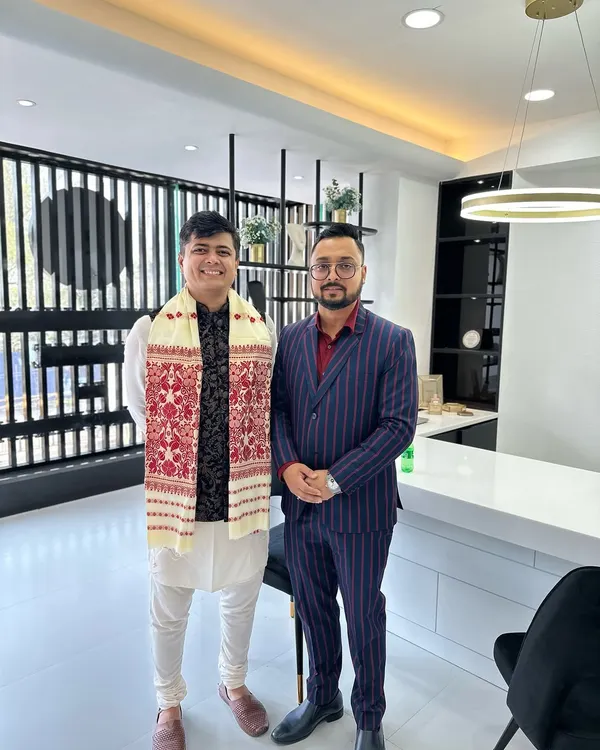 Posing with a client while wearing the traditional Assamese Gamusa. I believe in honoring local cultures and traditions in my work.