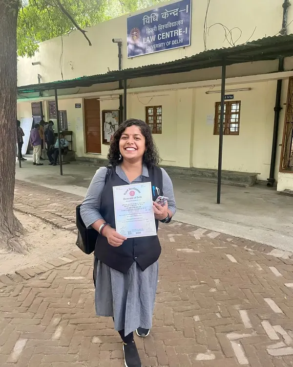 A proud moment holding a certificate outside the Law Centre at Delhi University. My legal education provided the foundation for my career and my passion for advocacy.