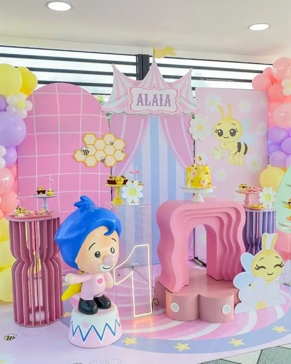Buzz buzz! A wonderfully sweet bee-themed first birthday for Alaia. This setup features a pastel color palette, honeycomb details, and cute character cutouts.