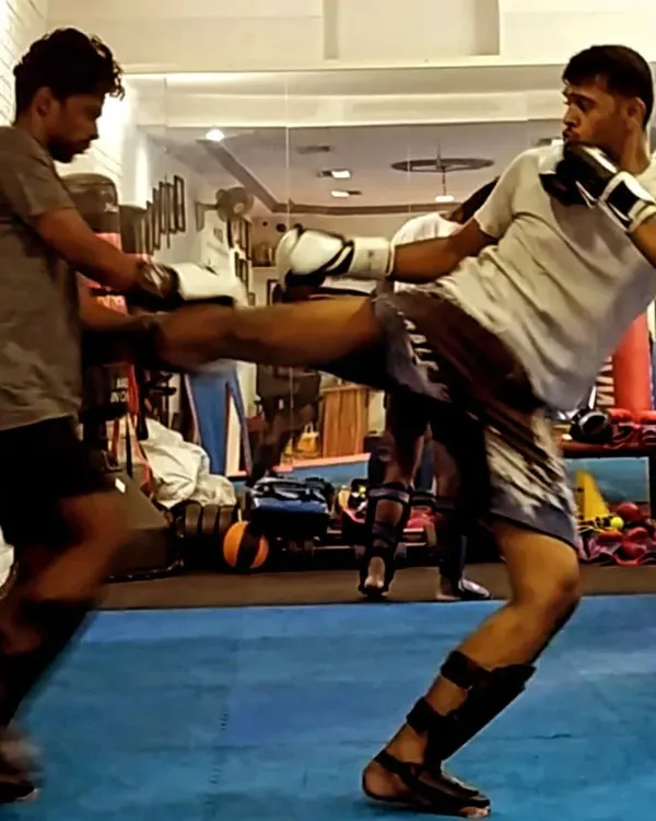 A strong kick starts with solid technique. Here, I'm sparring with a student at Ippon Institute, focusing on timing and distance for a body kick. We practice these drills to make our striking sharp and effective.