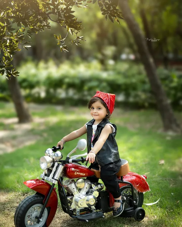 Taking the fun outside! This biker girl theme looks amazing in a natural park setting, creating a unique and adventurous portrait.