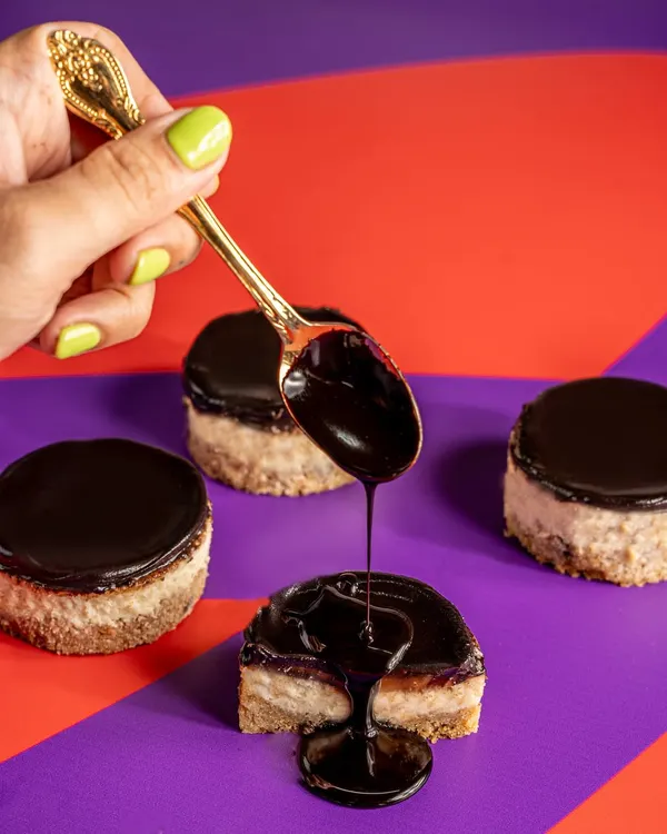 This is my showstopper, the Bebe Frank. It’s everything you could want in one bite: a chewy cookie base, creamy cheesecake, rich caramel, and a boozy Old Monk ganache, all finished with a sprinkle of sea salt.
