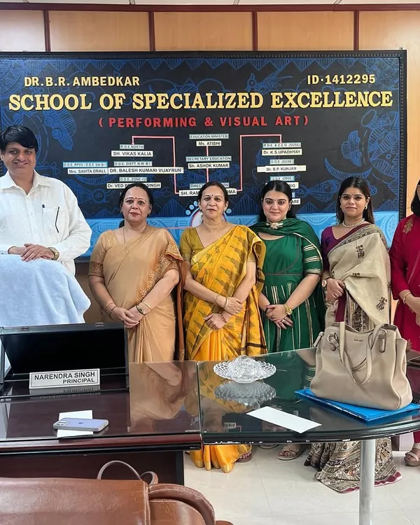 A formal photograph with the principal and esteemed faculty at the Dr. B.R. Ambedkar School of Specialized Excellence. It was an honor to be part of their district-level dance competition.