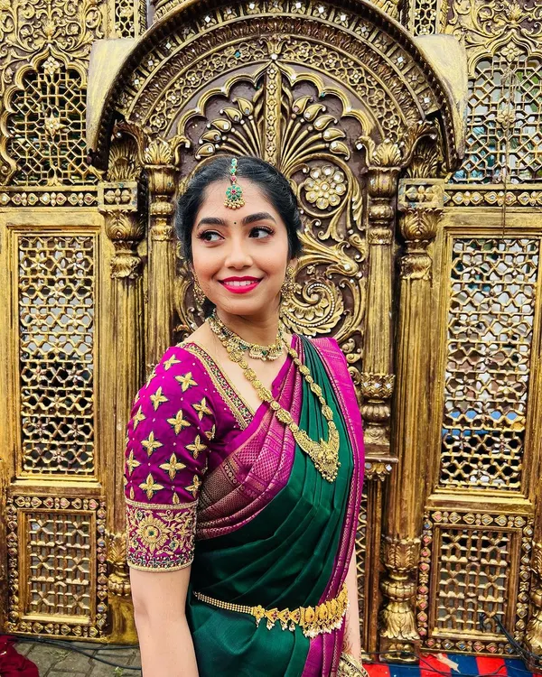 I believe in makeup that enhances your natural beauty, making you feel like the best version of yourself. This is a perfect example of a radiant muhurtham look for the groom's sister, focusing on glowing skin, a bright smile, and traditional South Indian jewelry.