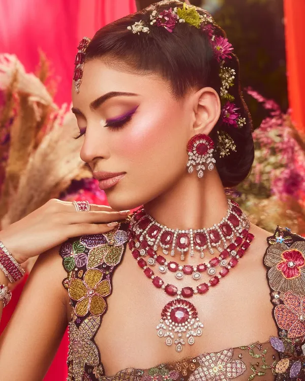 A celebration of bold beauty and femininity. This look features a vibrant purple winged liner, which I designed as part of the overall creative vision for the shoot.