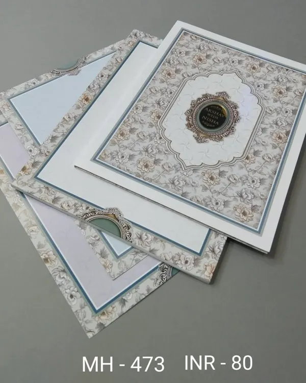 A beautiful invitation set with a floral and patterned design, available with multiple pastel inserts. The card has a classic and elegant feel.