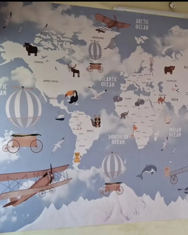 This whimsical world map wallpaper is perfect for a child's room or play area. It's both decorative and educational, featuring continents, oceans, and cute animals to inspire a sense of adventure.