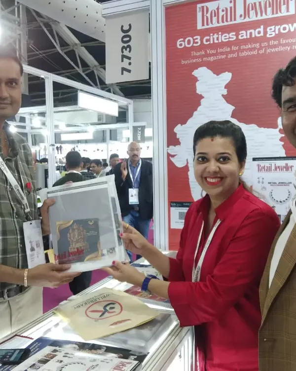 Here I am interacting with a potential client at the Retail Jewellers India booth during a major exhibition. My goal is to be a proactive brand ambassador, sparking conversations and generating leads.