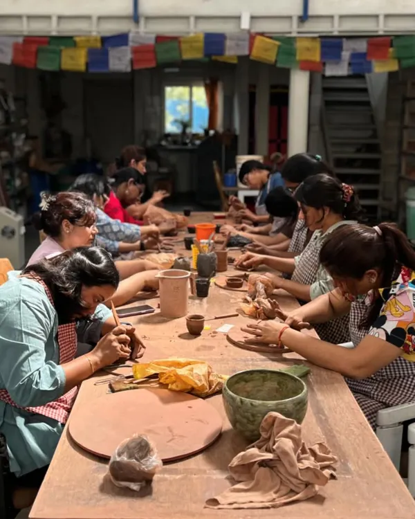 Welcome to my studio, a place where creativity and community come together. This is a glimpse from a team building retreat, where everyone is lost in the moment, shaping clay and making memories.