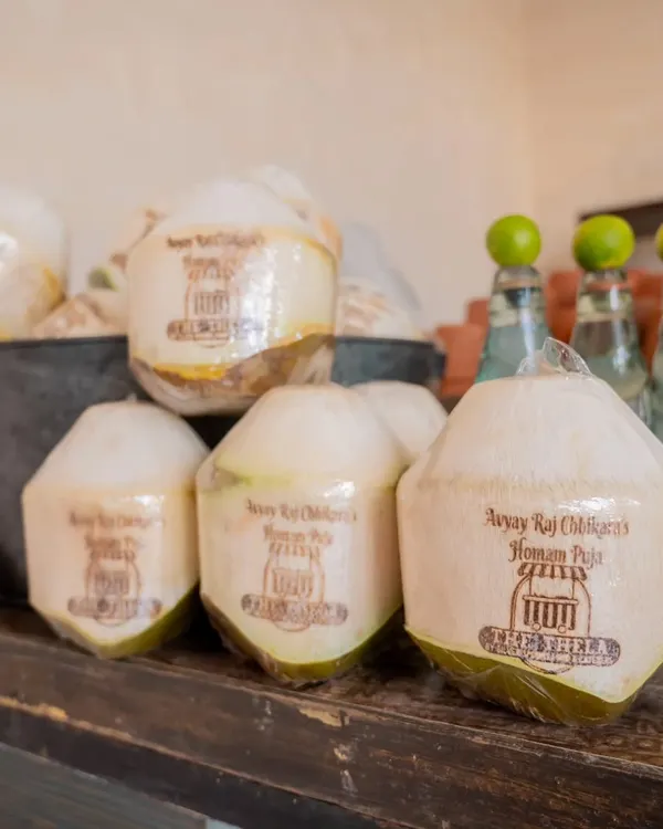 Custom-branded coconuts for a 'Homam Puja' event. This small detail adds a personalized and premium touch, making the welcome drink a memorable part of the experience.