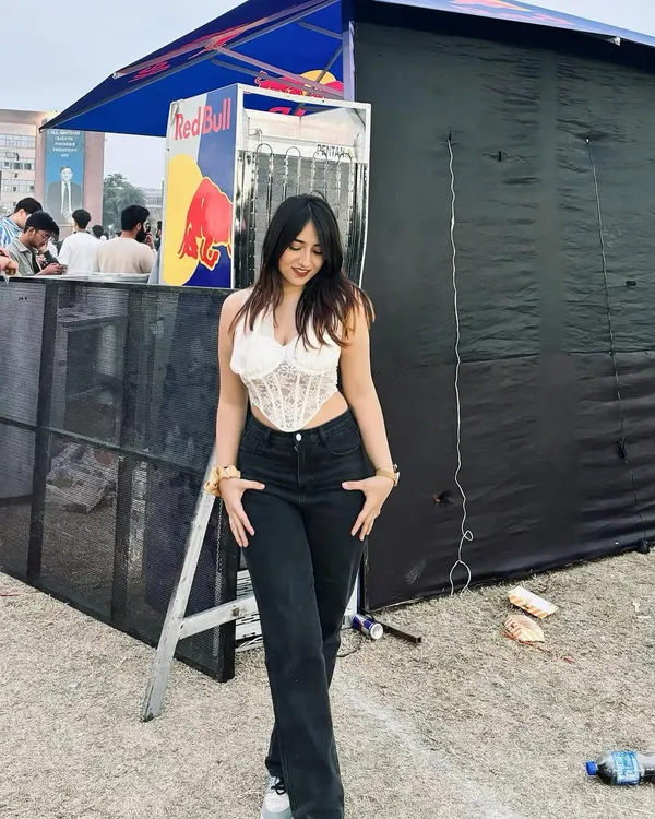 A cool and casual look featuring a white corset top from NewMe at a Red Bull event. This shows how I style trendy pieces for everyday events.