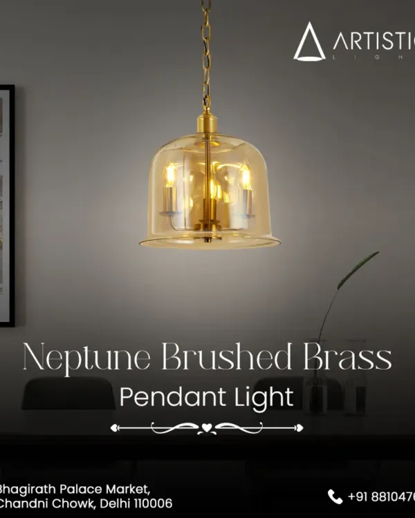 The Neptune Brushed Brass pendant features a classic bell-shaped amber glass shade that encases three candle-like bulbs. This fixture provides a warm, inviting glow and adds a touch of timeless elegance to any room.