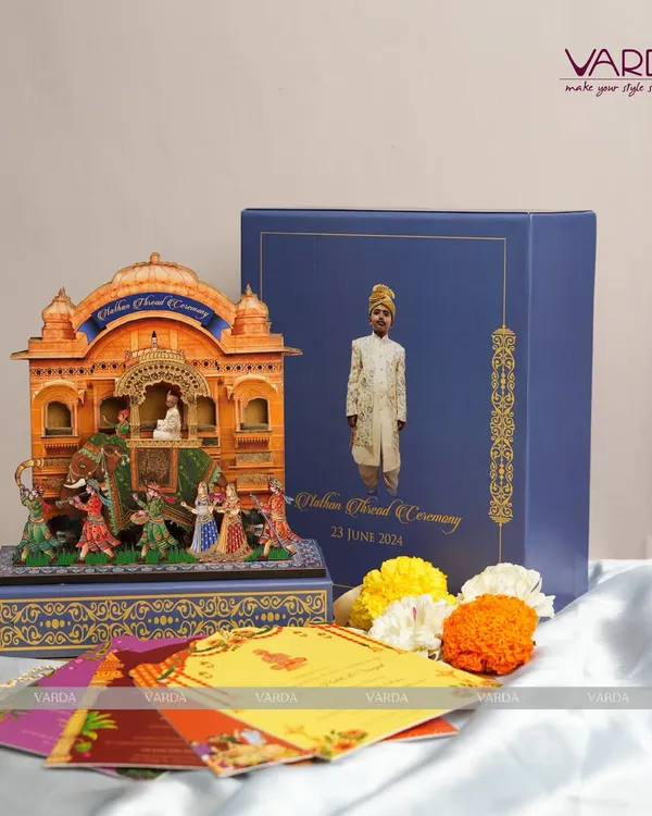 This exquisite pop-up invitation box was created for an Upanayanam, or thread ceremony. The intricate, multi-layered design depicts the sacred ritual in a miniature diorama, transforming the invitation into a cherished keepsake that honors this significant rite of passage.
