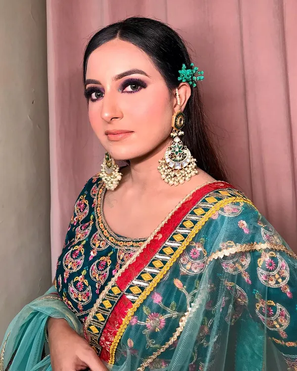 A bold and beautiful look featuring a deep purple smokey eye. I balanced the strong eye makeup with a neutral lip and softly flushed cheeks, making it a perfect statement look for a Mehendi or Sangeet function.