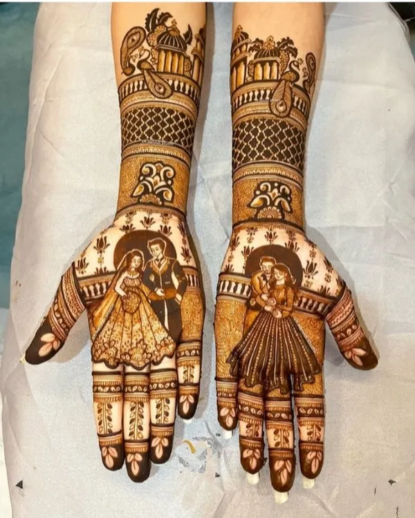 This is the kind of full bridal mehndi I love to create. It features detailed couple portraits on both palms, surrounded by traditional palace architecture and fine patterns, making your hands tell a beautiful story.