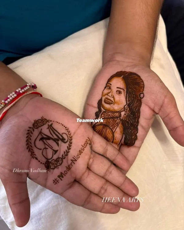 This is what I mean when I say let's make your mehendi personal. I created this detailed portrait of the bride on the groom's palm, a truly modern groom mehendi idea that was such a special surprise for her. On the other hand, we have his bride's initial 'M' inside a delicate wreath.